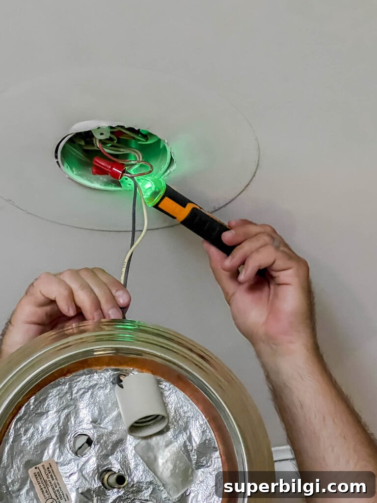 Replace a Light Fixture: Step-by-Step Safety Guide 3 Test voltage on light box