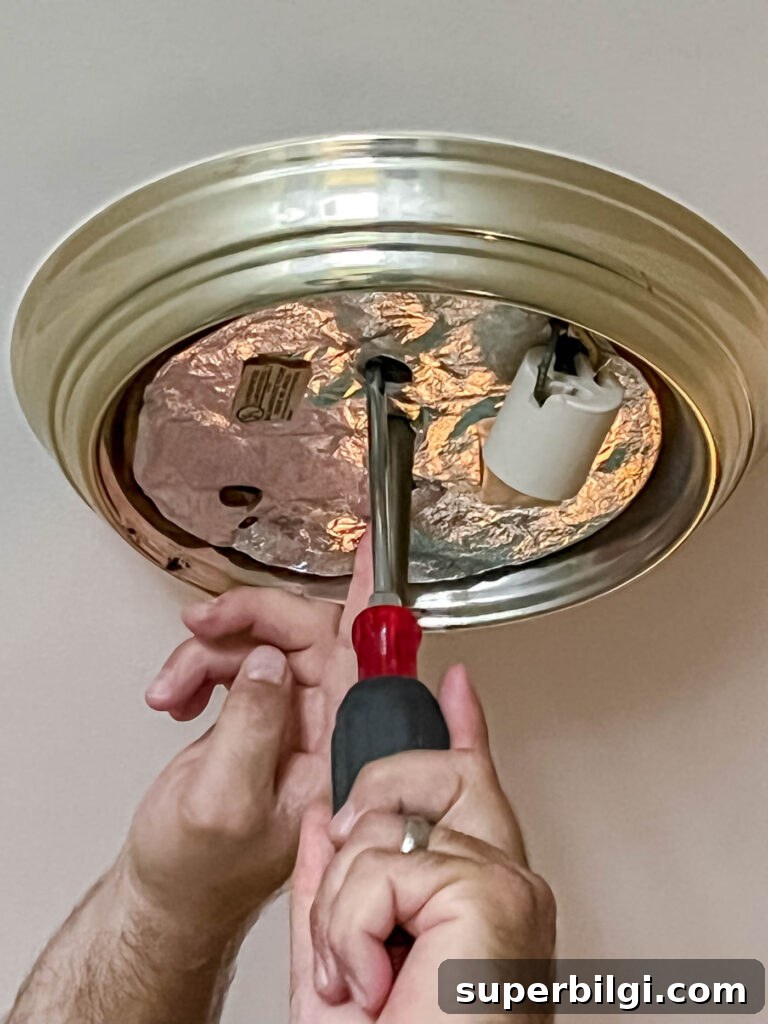 Replace a Light Fixture: Step-by-Step Safety Guide 4 Remove old light fixture