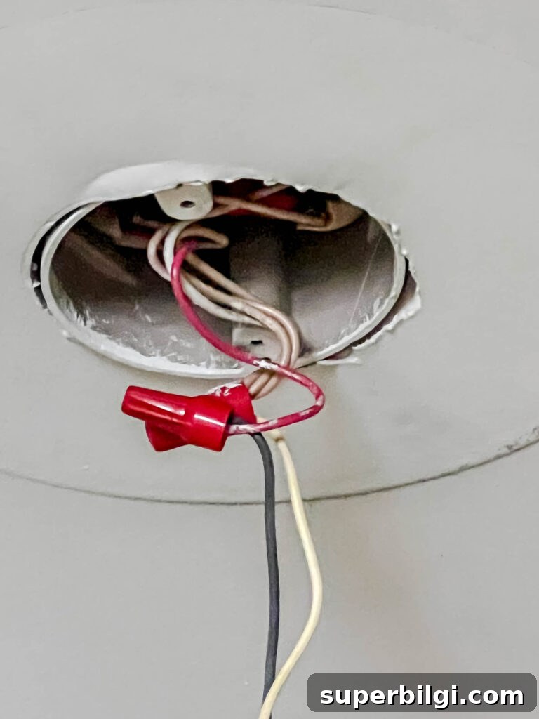 Replace a Light Fixture: Step-by-Step Safety Guide 5 Untwist old nut caps