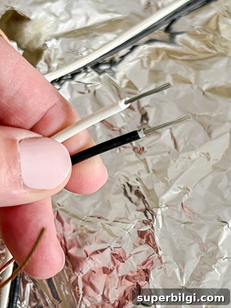 Replace a Light Fixture: Step-by-Step Safety Guide 7 Leave 1/2 inch of wire exposed