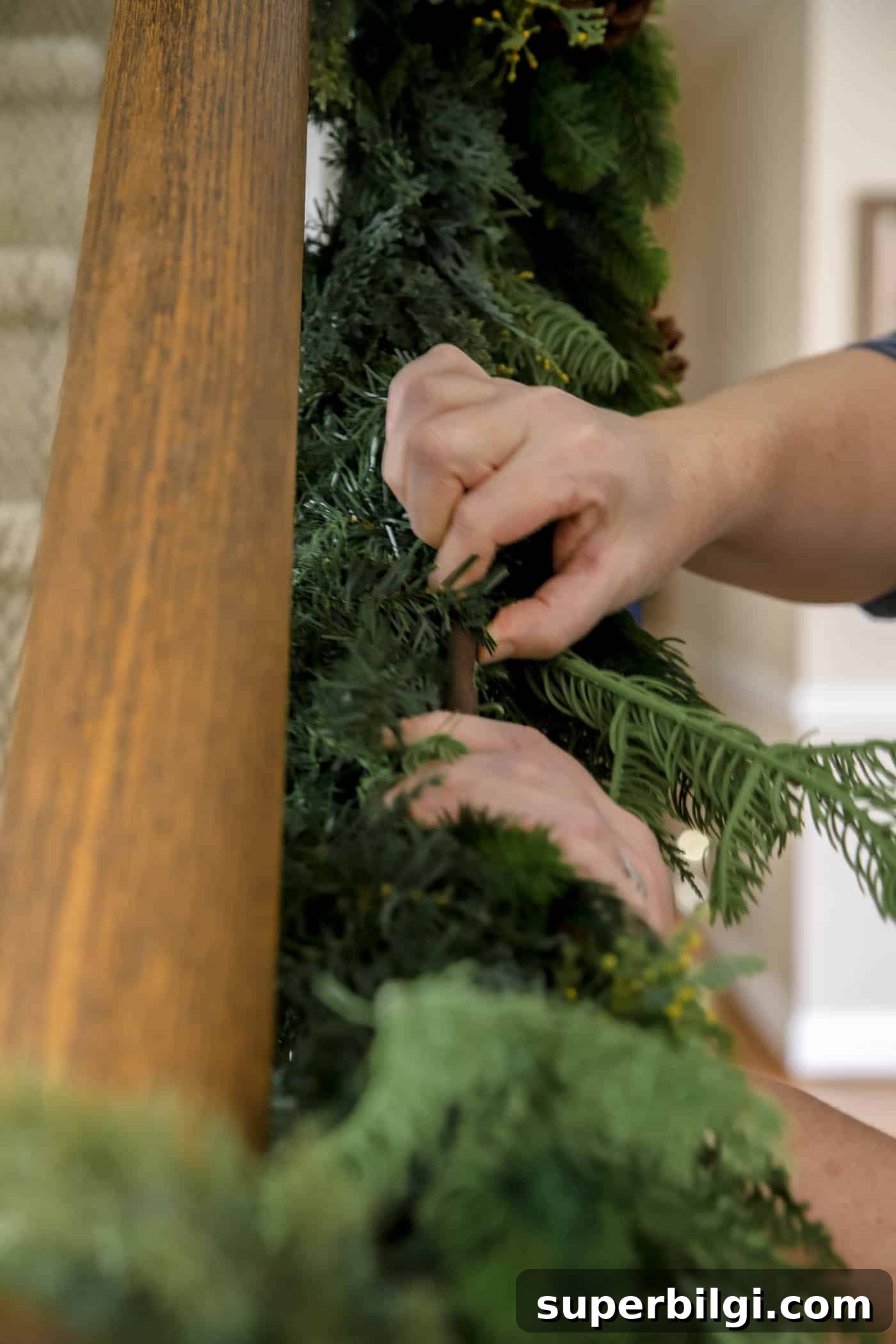 How to Hang Garland on a Staircase or Banister 8 how to add garland to the stairs