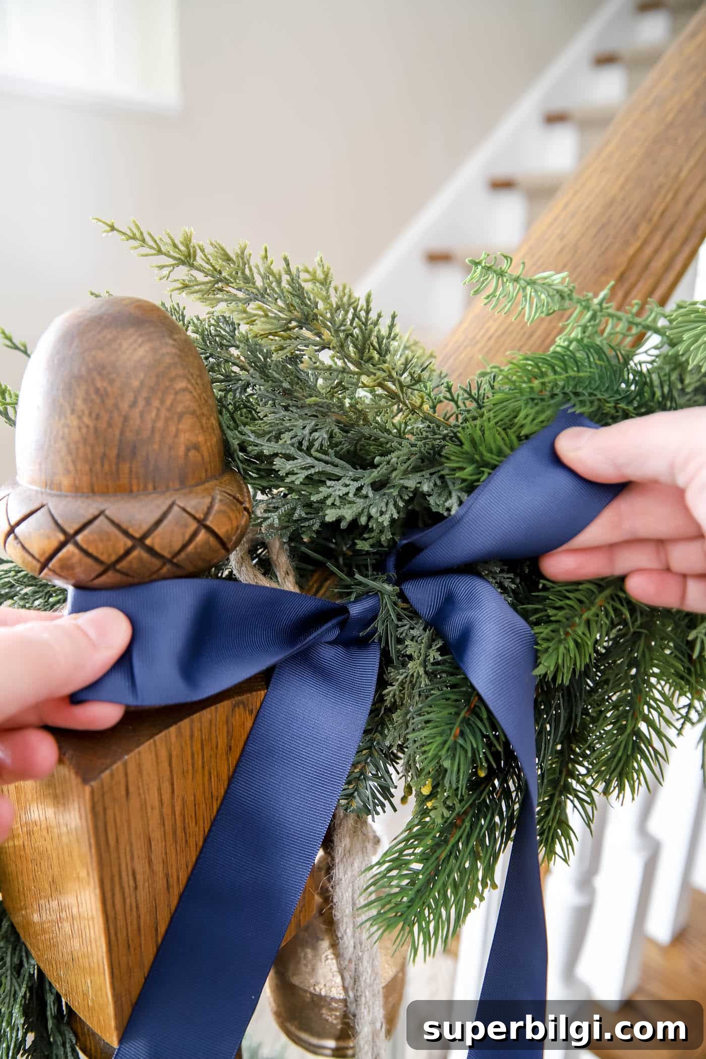 How to Hang Garland on a Staircase or Banister 9 Bow accessories on stairwell garland