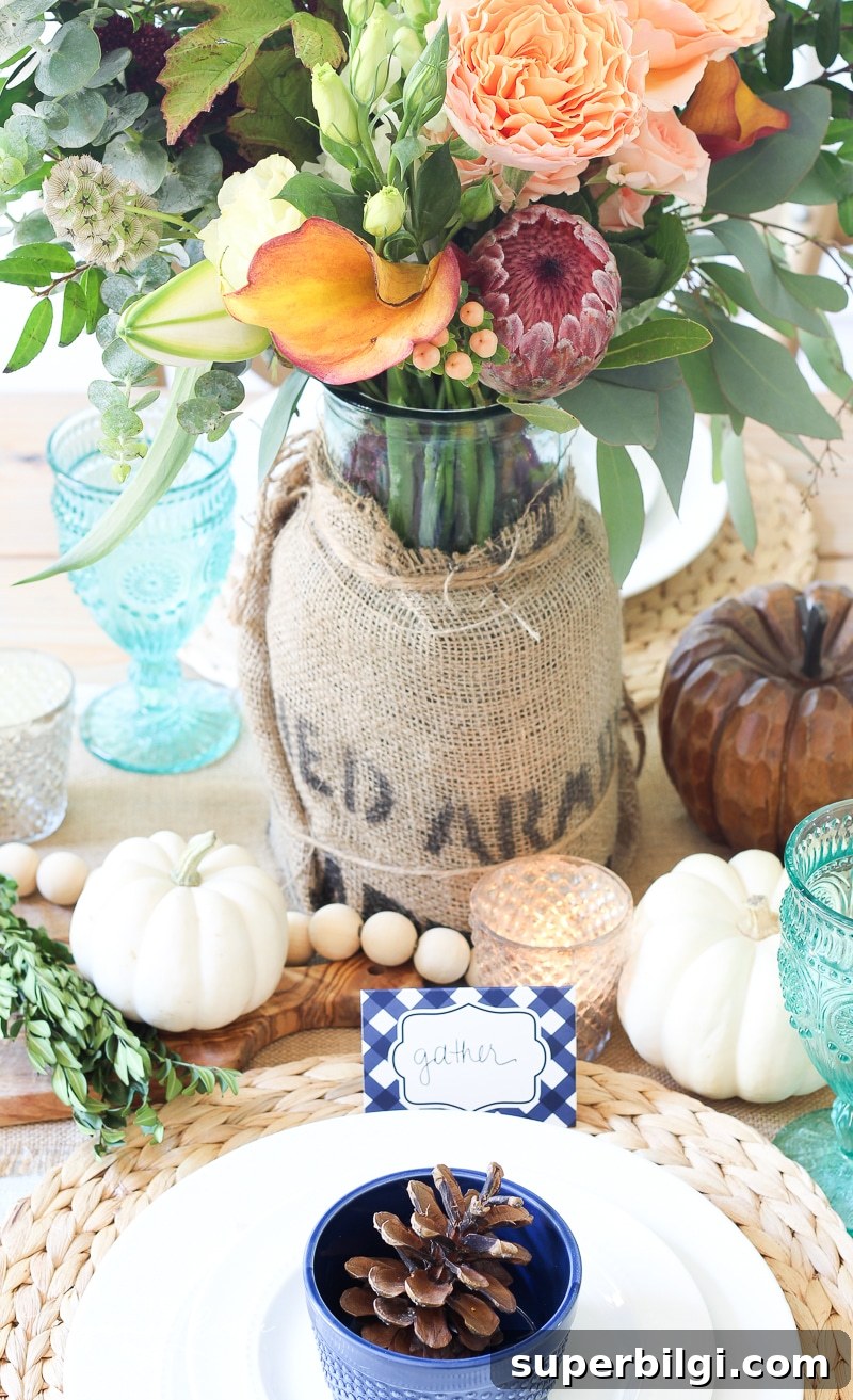 Stylish Fall Centerpiece Ideas for a Warm, Inviting Home 2 Lantern, Candles and Farmgirl Flowers Fall Tablescape