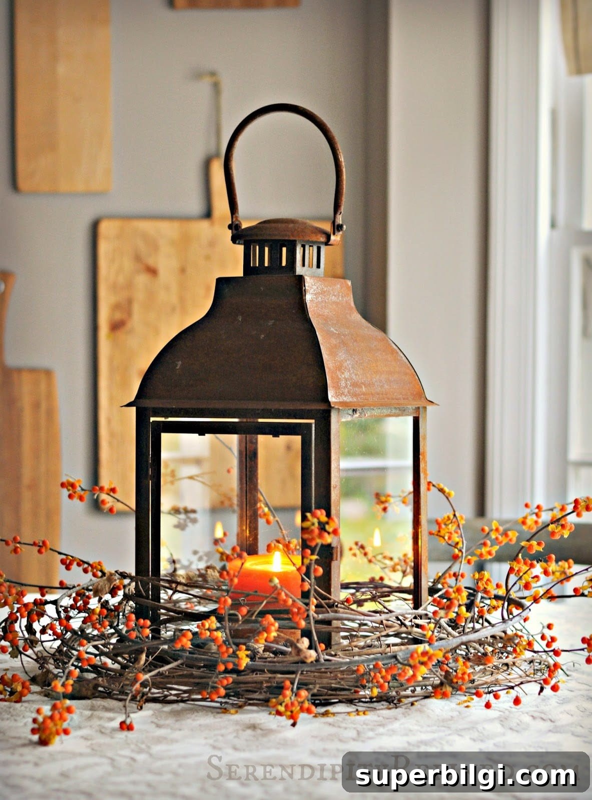 Stylish Fall Centerpiece Ideas for a Warm, Inviting Home 5 rustic lantern wrapped in grapevine and berry sprig