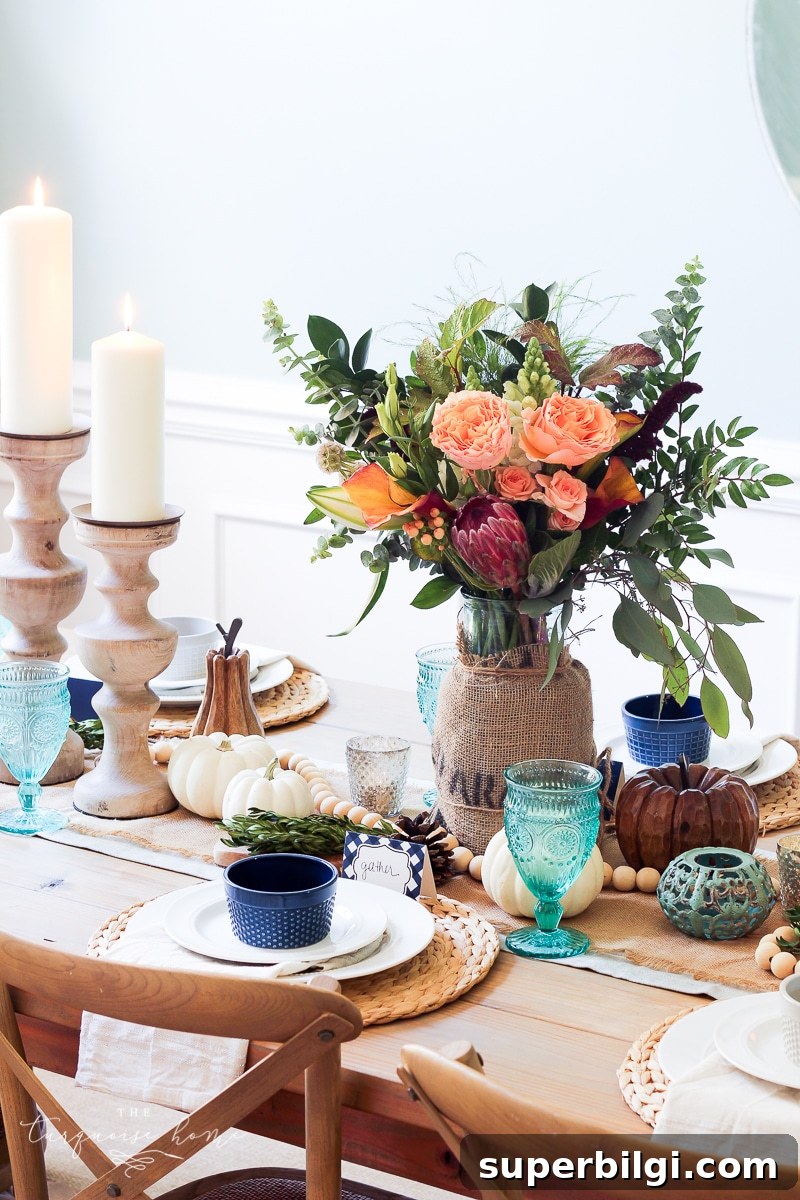 Stylish Fall Centerpiece Ideas for a Warm, Inviting Home 6 Lantern, Candles and Farmgirl Flowers Fall Tablescape