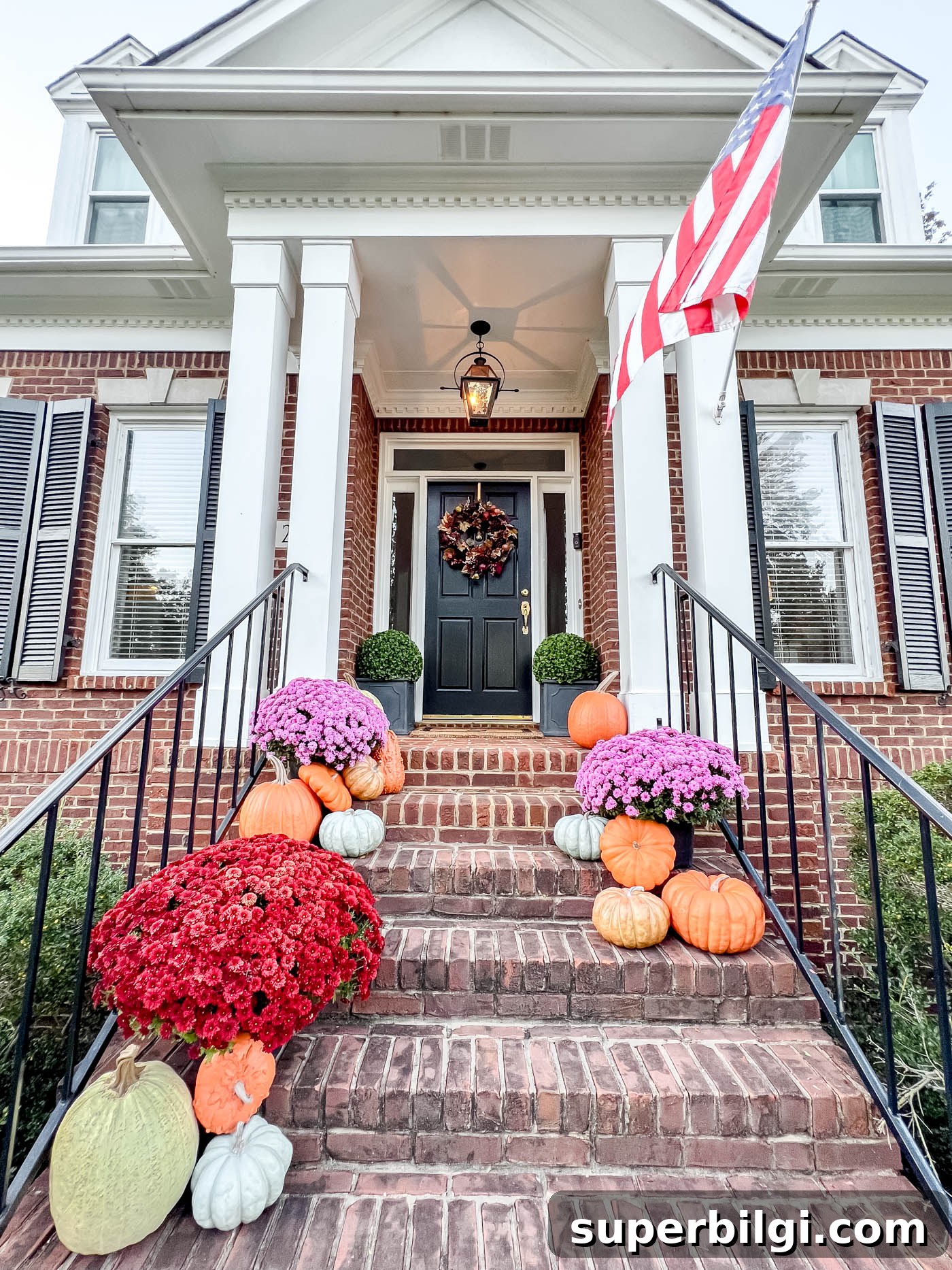 Fall Decorating Ideas to Create a Cozy Home 20 long shot of front porch with realistic fake pumpkins