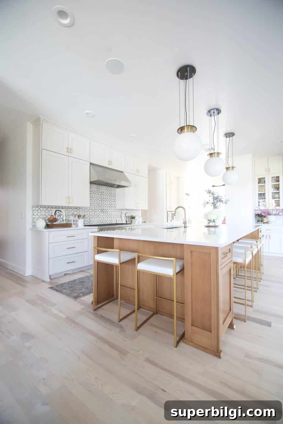 Benjamin Moore Pale Oak OC-20: Warm Greige for Interiors 8 benjamin moore pale oak cabinets in a kitchen filled with natural light.