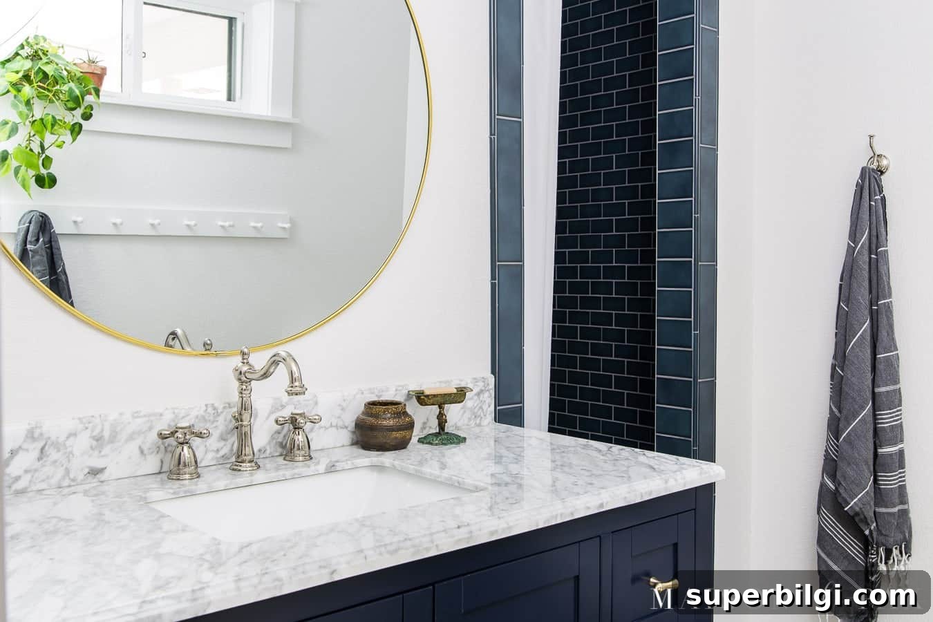 Sherwin-Williams Snowbound Paint Color: Undertones and Uses 7 bathroom with white walls and navy accents