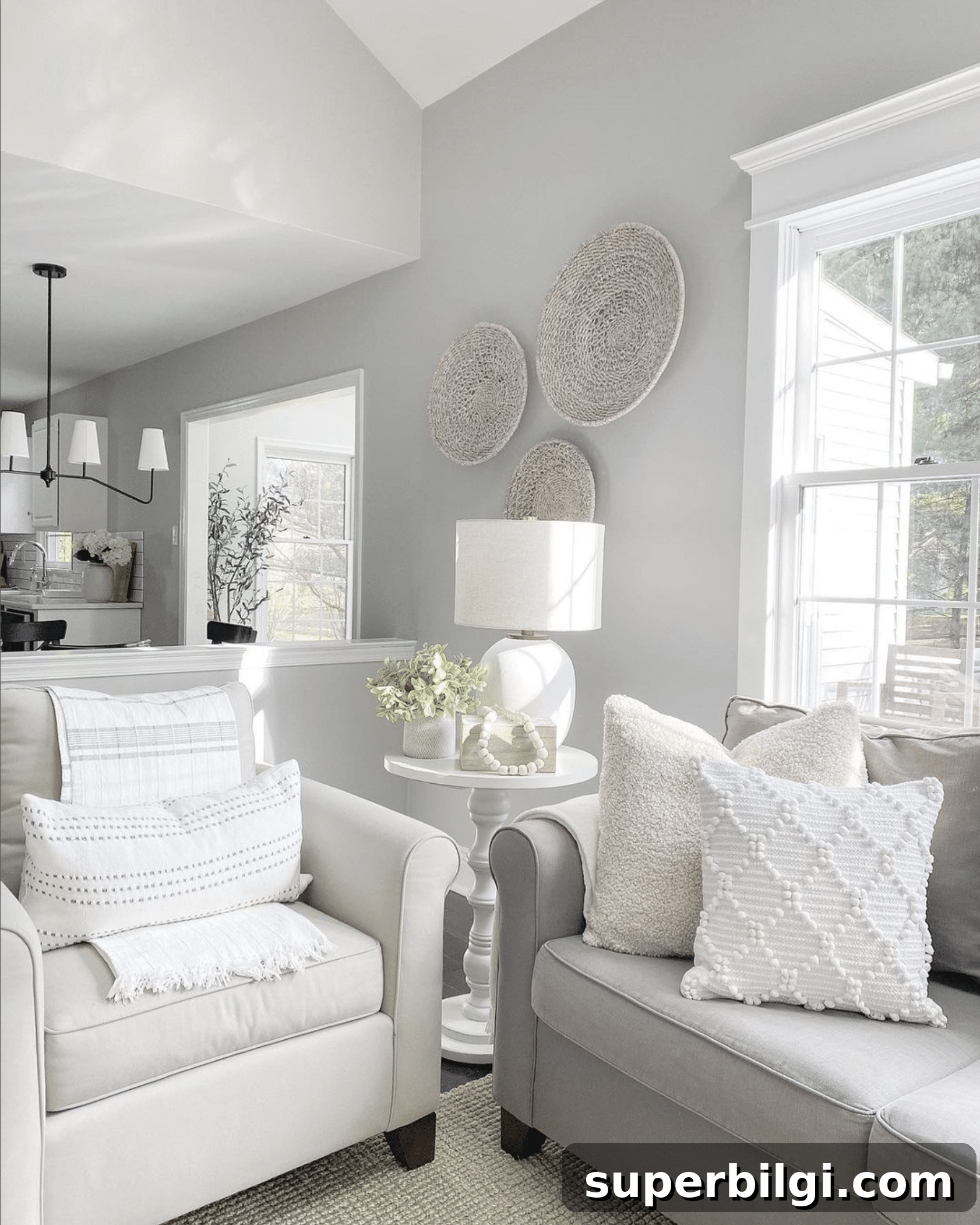 Benjamin Moore Stonington Gray Paint Color: Swatches & Hex Code 5 Stonington Gray living room walls with neutral sofas and baskets hanging on the walls.