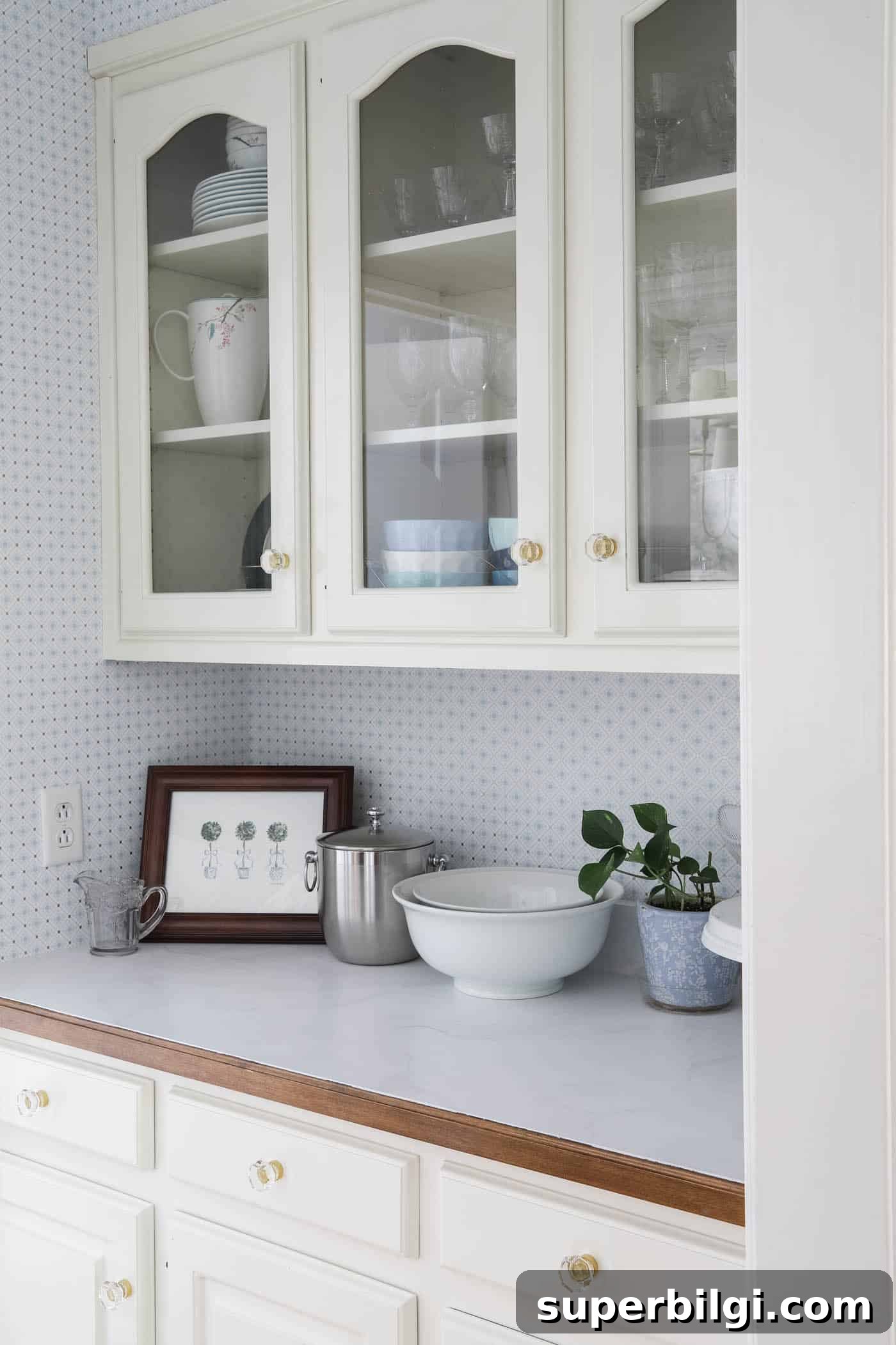 butler's pantry with painted marble-like countertops.