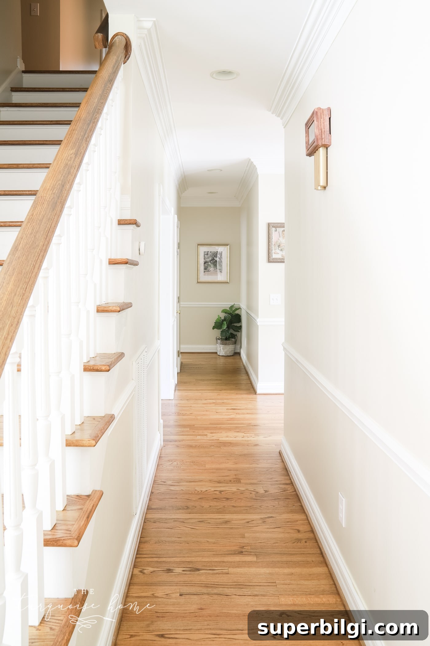 long hallway with medium brown wood floors.