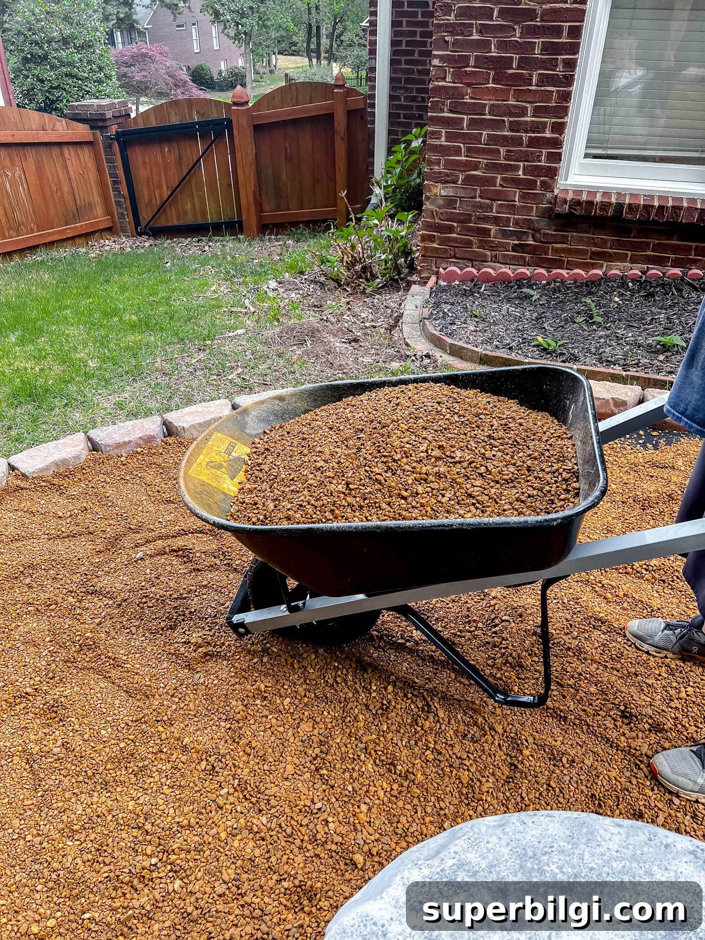 How to Build a Pea Gravel Fire Pit Area 11 Add pea gravel to fire pit area.