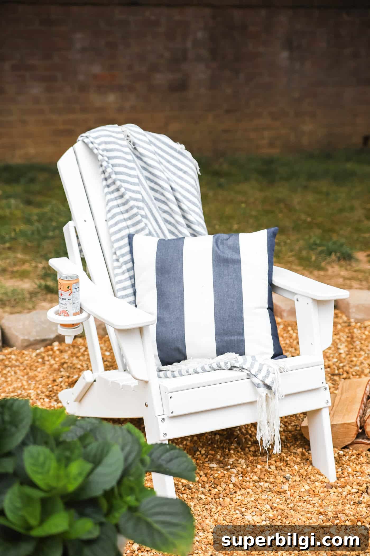 How to Build a Pea Gravel Fire Pit Area 13 white adirondack chair with striped navy and white pillow