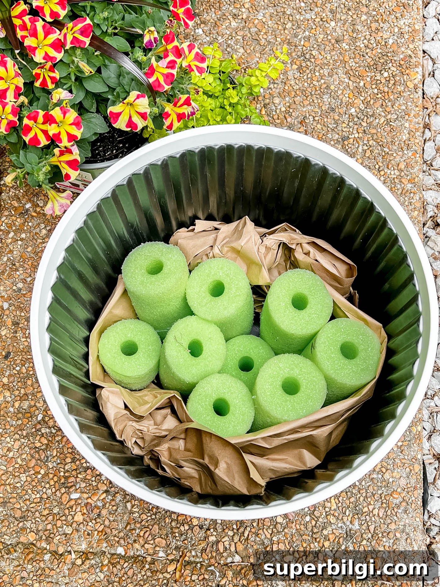 How to Plant Flowers in Pots, Planters and Containers 7 Add filler to pot before soil