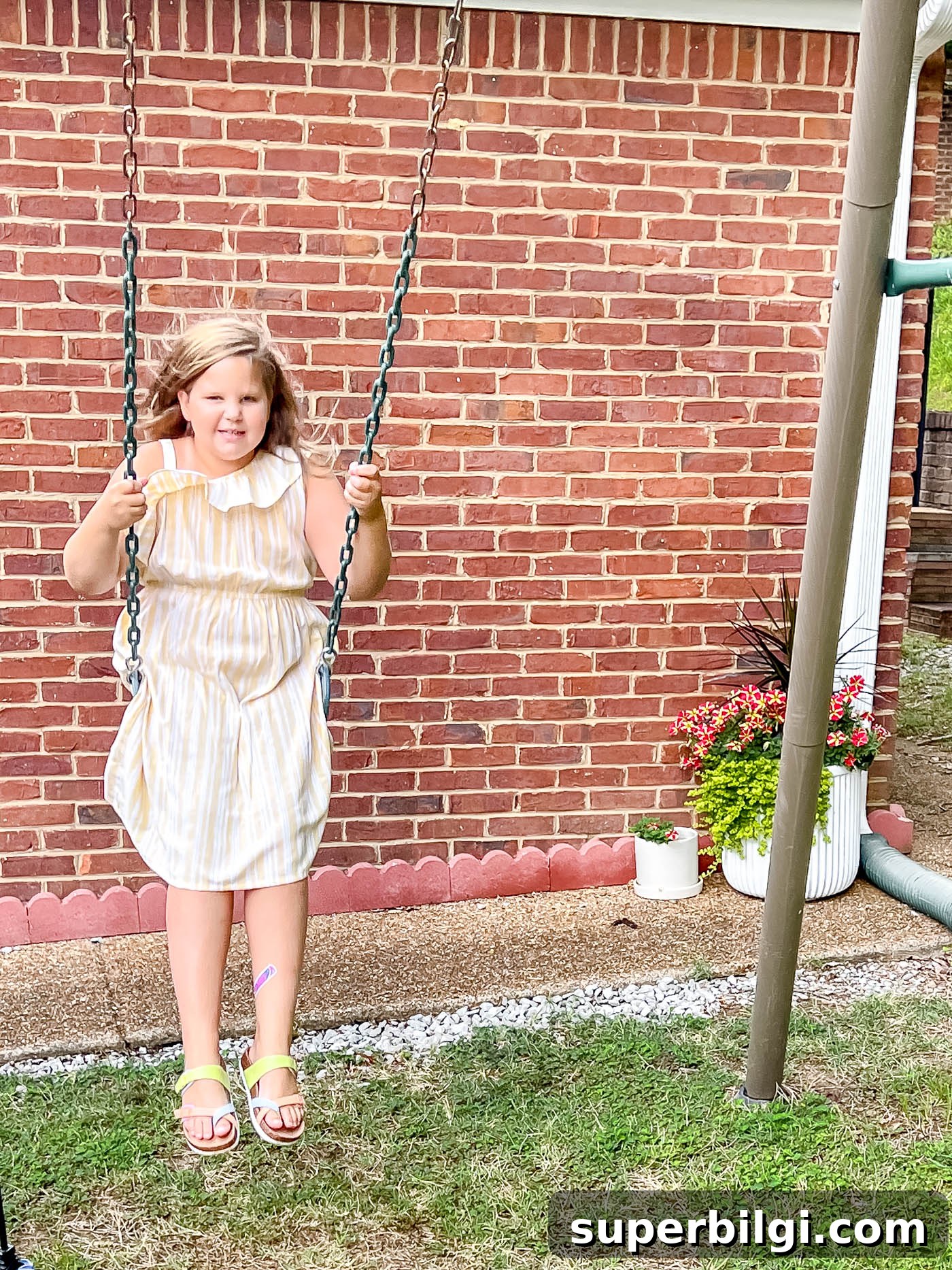 Life Update: Backyard Makeover Progress and What's Next 4 girl swinging in pretty dress