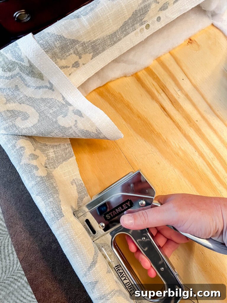 How to Make a Fabric Covered Cornice Board for Windows 14 DIY cornice board stapling fabric