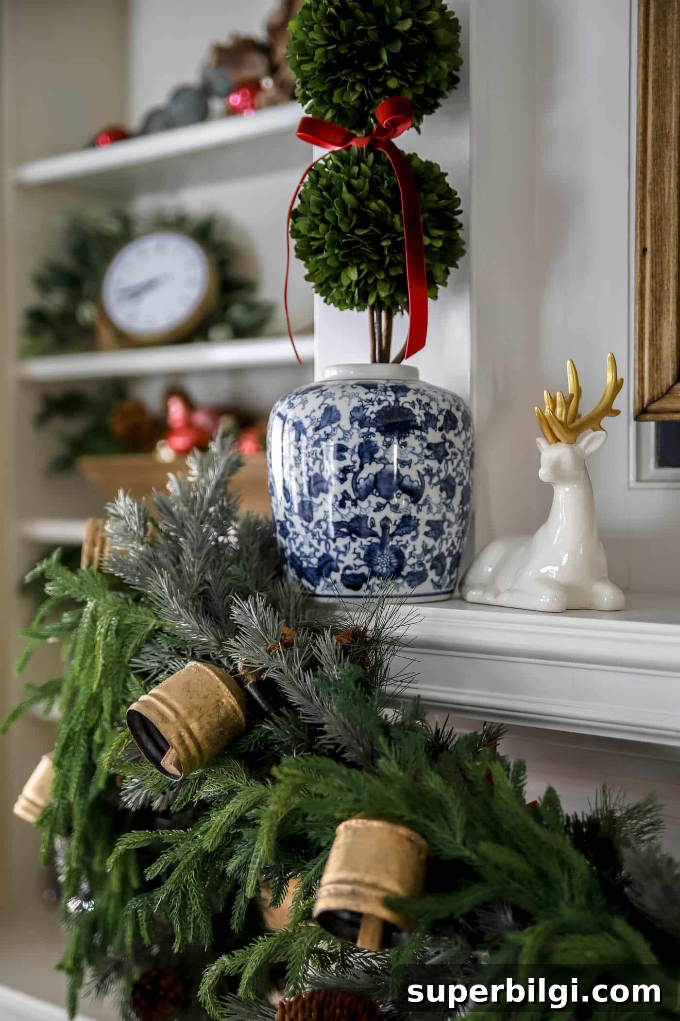 Red, White and Gold Christmas Decor Ideas 8 holiday mantel decor with ceramic deer and ginger jar with boxwood topiary and red ribbon