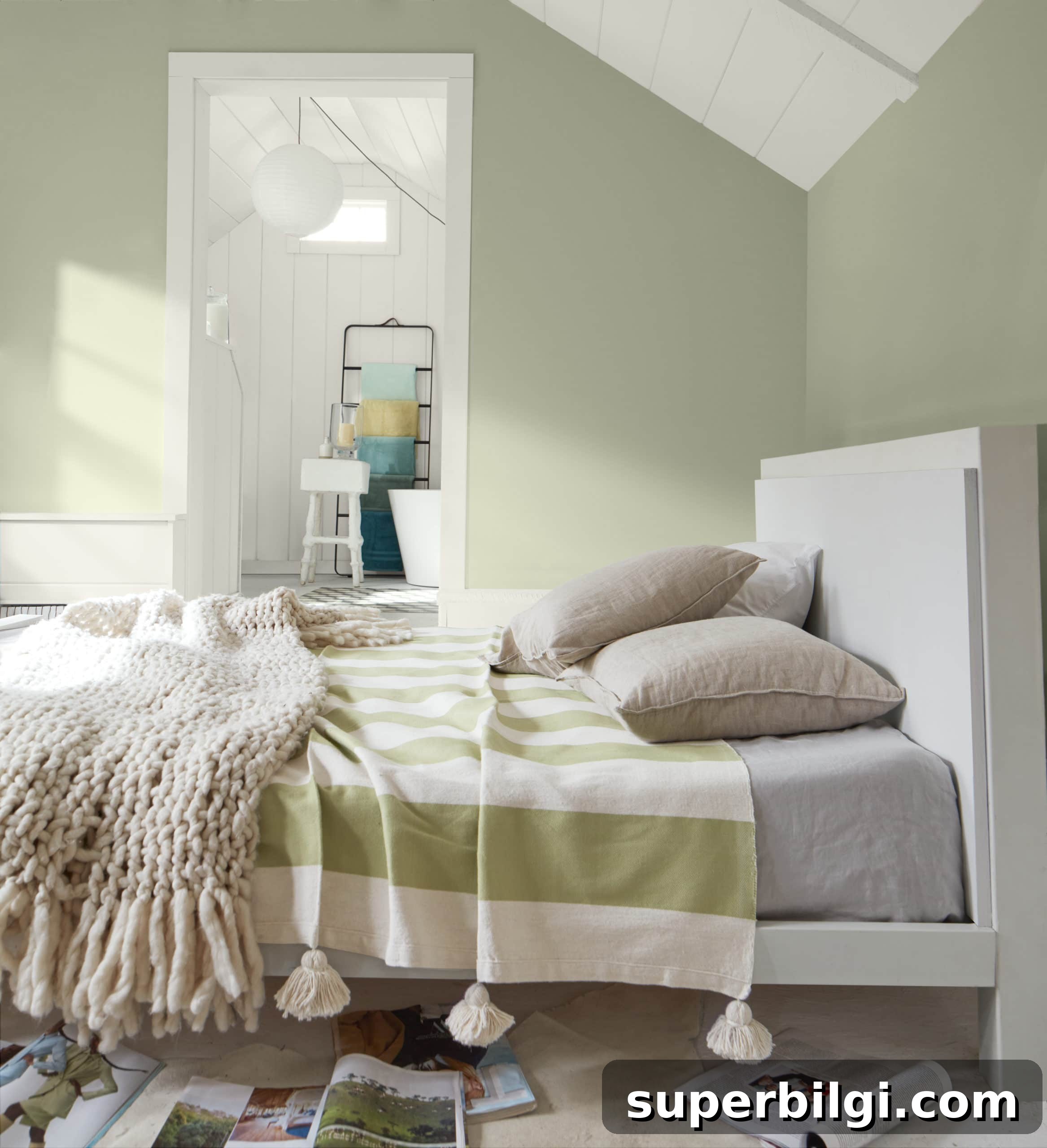 Benjamin Moore October Mist walls with white bed and green and white striped bedding.