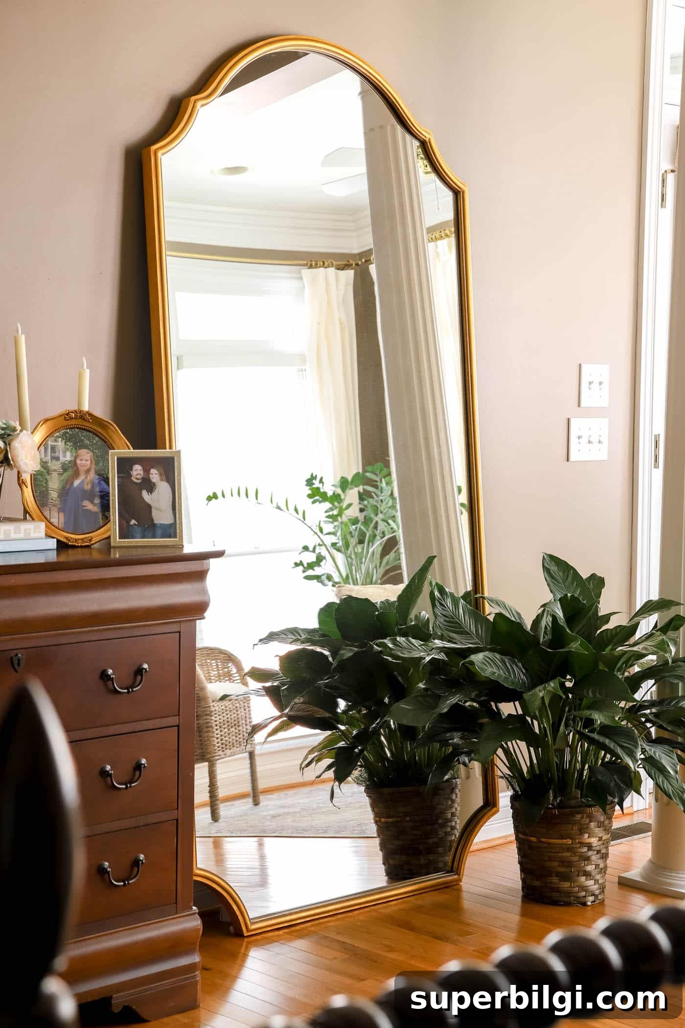 13 Creative Corner Decor Ideas to Transform Small Spaces 16 large leaning mirror with a large plant next to it