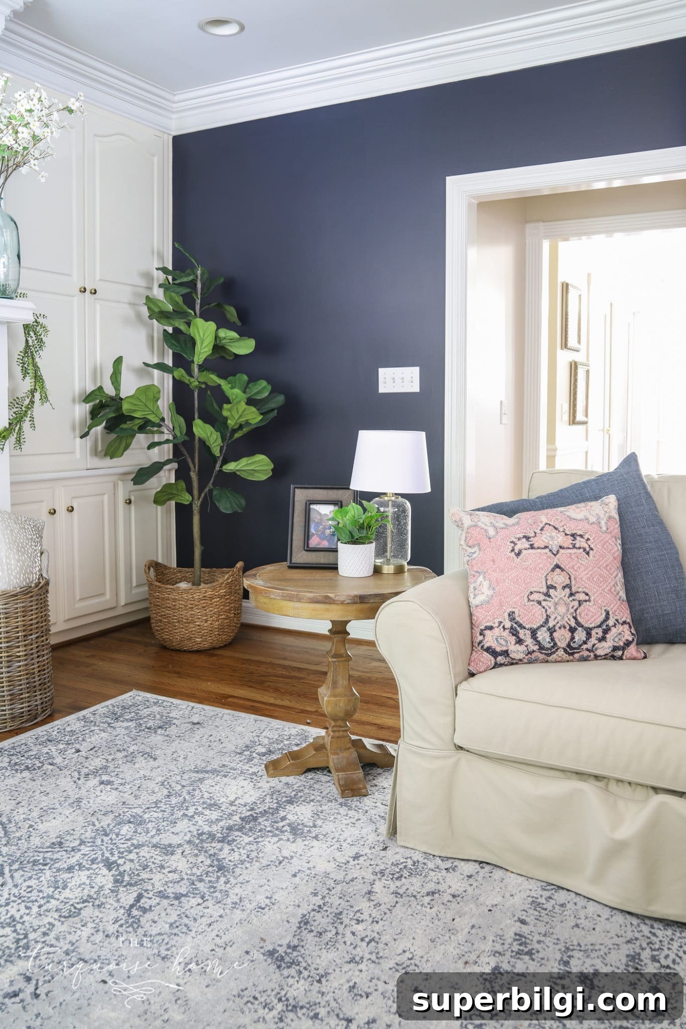 13 Creative Corner Decor Ideas to Transform Small Spaces 3 fiddle leaf fig in corner of navy living room with end table and decor.