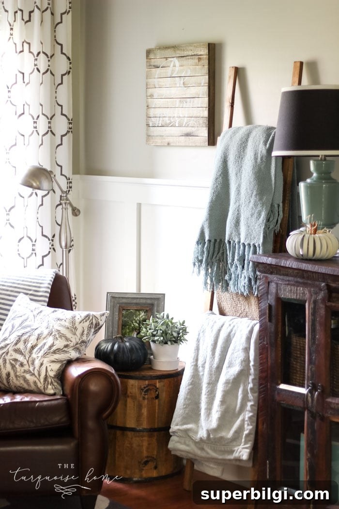 13 Creative Corner Decor Ideas to Transform Small Spaces 8 A cozy fall corner with a blanket ladder, leather armchair - and pumpkins!!