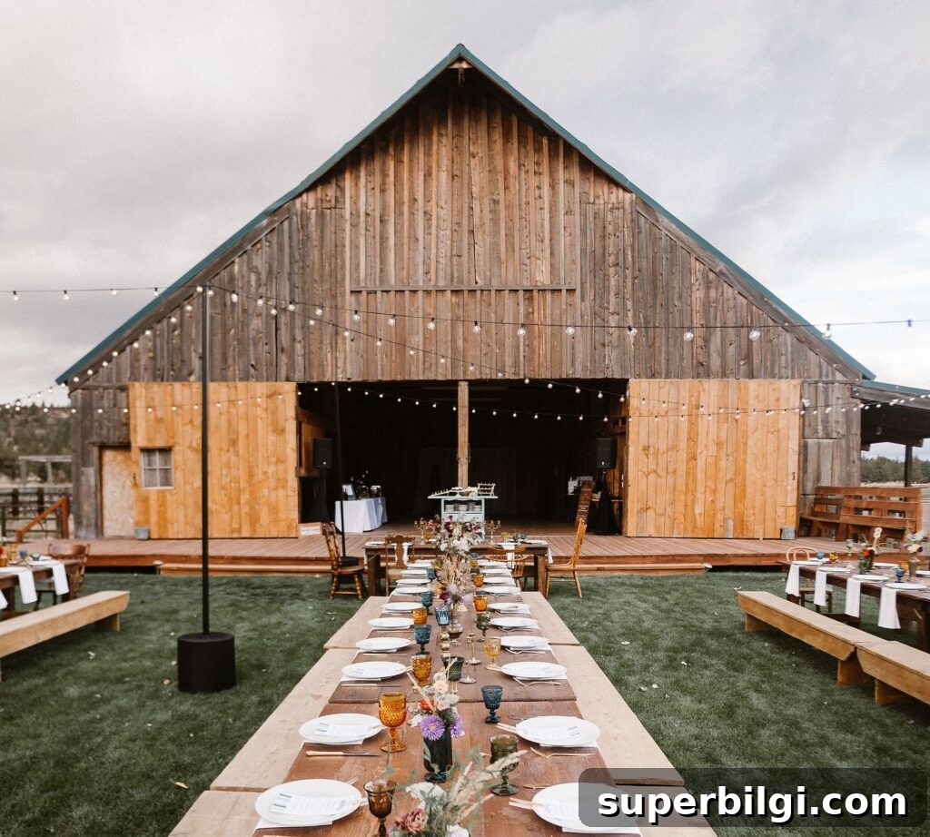 Hang Outdoor String Lights: DIY Patio and Backyard Tips 6 barn with party tables and string lights.