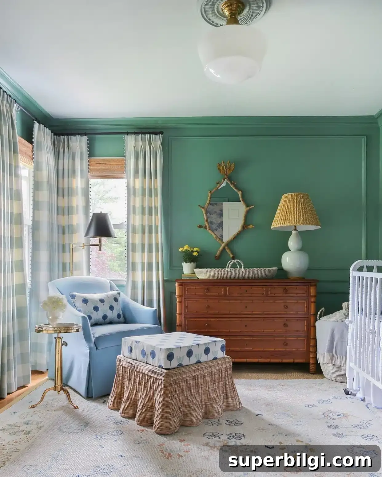 20 Nursery Paint Colors and Accent Wall Ideas for Baby Rooms 14 Lehigh Green nursery with blue chair and neutral window treatments.