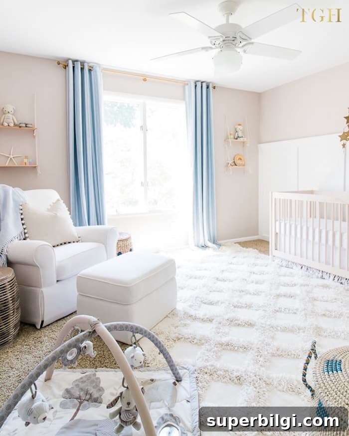 20 Nursery Paint Colors and Accent Wall Ideas for Baby Rooms 16 neutral beige nursery with blue curtains and comfortable white rug.