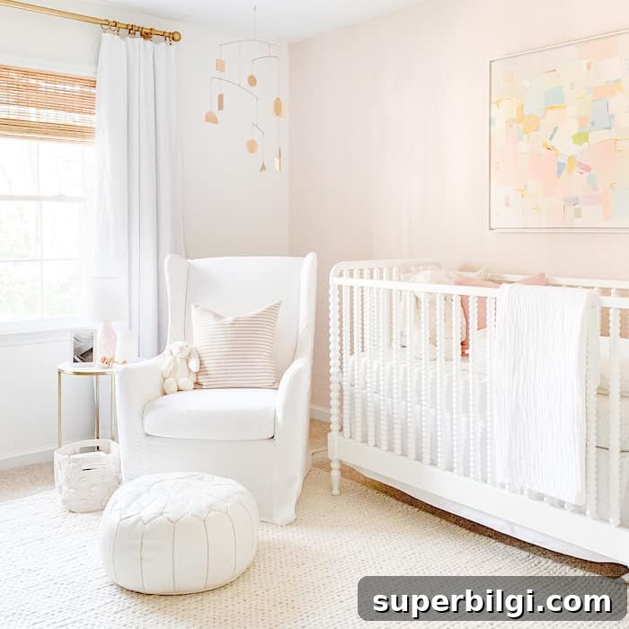 20 Nursery Paint Colors and Accent Wall Ideas for Baby Rooms 22 Girl's nursery with an accent wall of Schumacher Raindots Polka Dots wallpaper in Washed Pink.