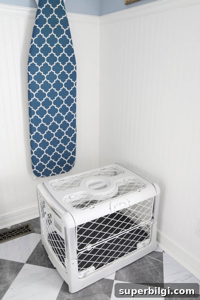 10+ Stylish Dog Crate Furniture Ideas for Modern Homes 5 Revol Diggs dog crate in white with a gray pad cover in a laundry room.