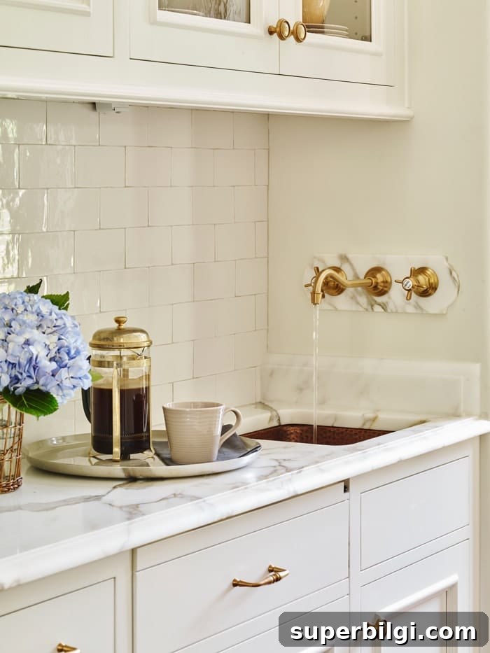 10+ Butler's Pantry Ideas for Stylish, Functional Spaces 13 white butler's pantry with subway tile backsplash, marble countertop, brass faucet and small copper sink.