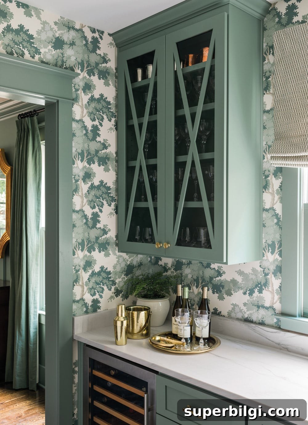 10+ Butler's Pantry Ideas for Stylish, Functional Spaces 18 dark green cabinetry and botanical wallpaper in a butler's pantry with marble countertops.
