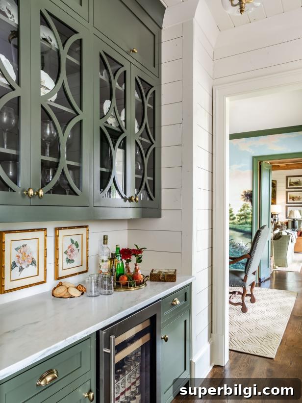 10+ Butler's Pantry Ideas for Stylish, Functional Spaces 20 green cabinets in a butler's pantry with white shiplap walls and dark wood floors.