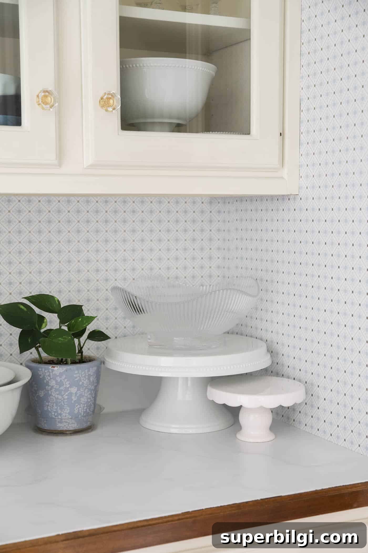 10+ Butler's Pantry Ideas for Stylish, Functional Spaces 6 marble countertops with blue and white geometric wallpaper on the walls.
