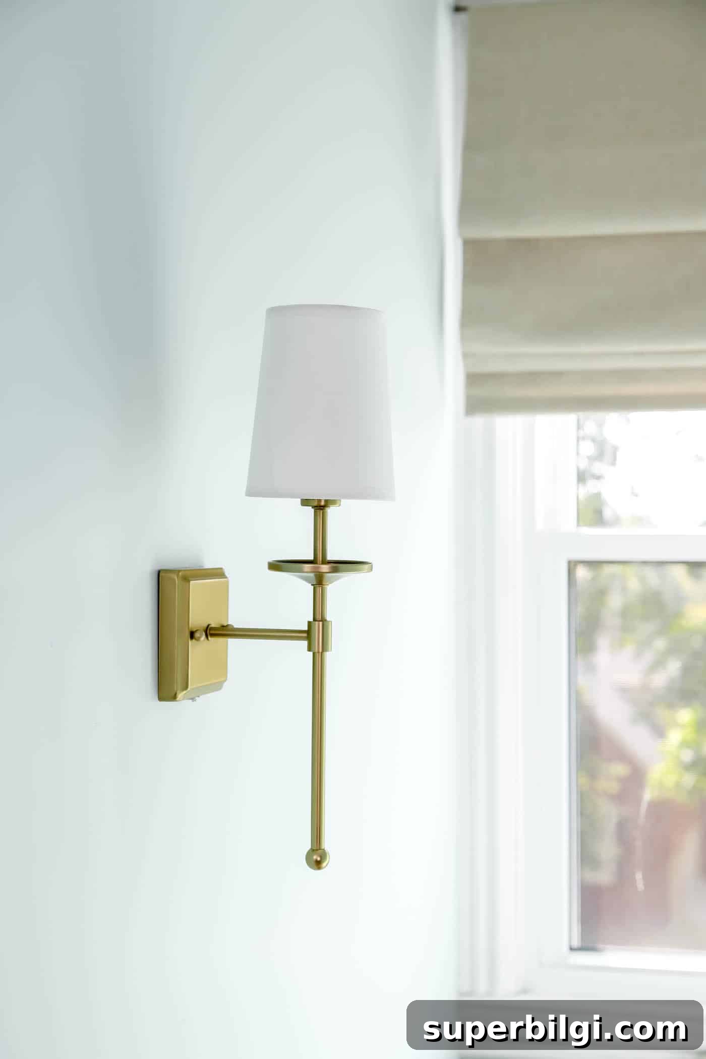 Transform Your Coastal Book Nook: Cozy Seaside Reading Corner 9 brushed gold sconce light.