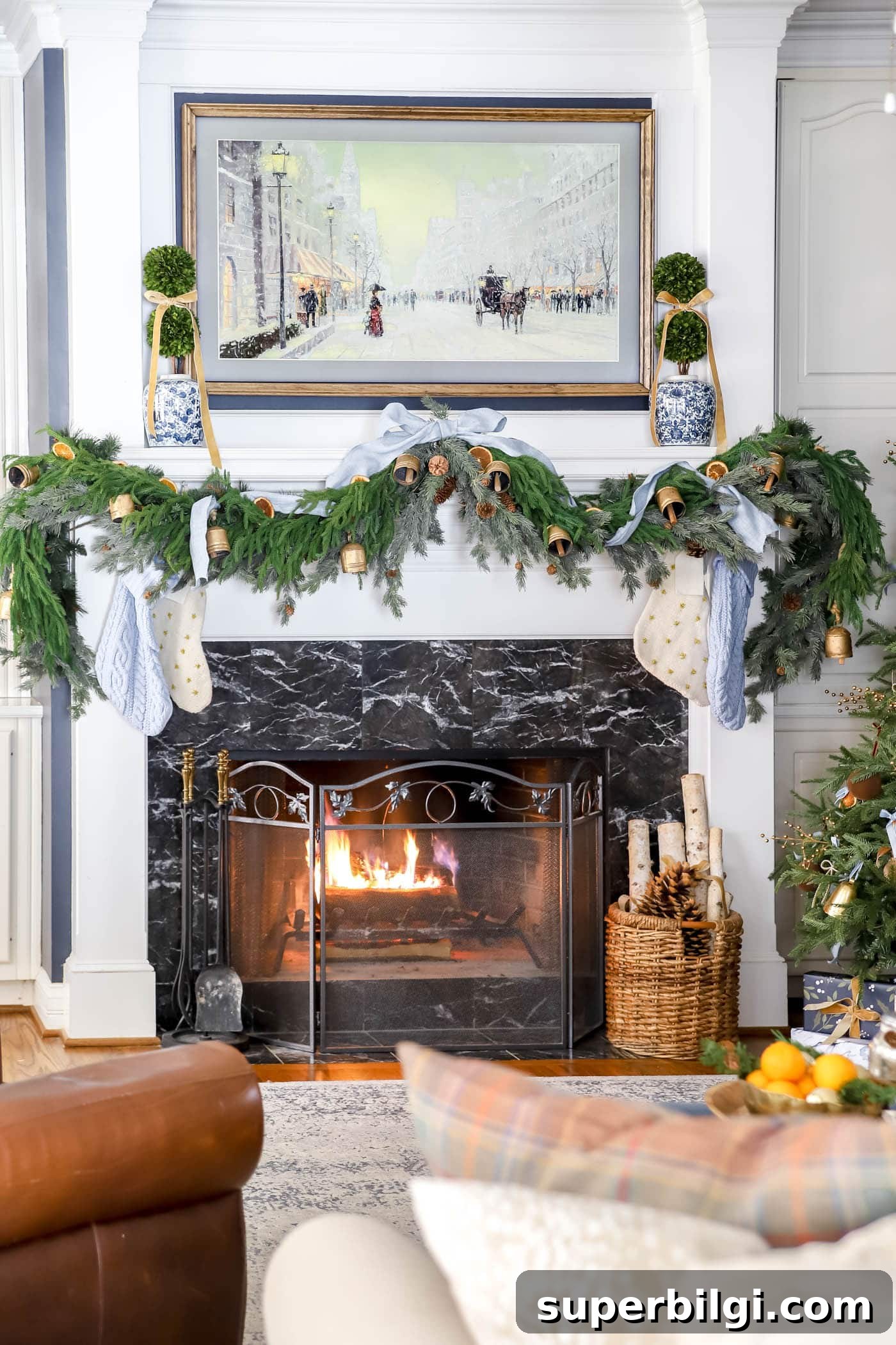 Orange, Blue and Brown Christmas Decor Ideas 11 Christmas mantel with blue and orange decor.