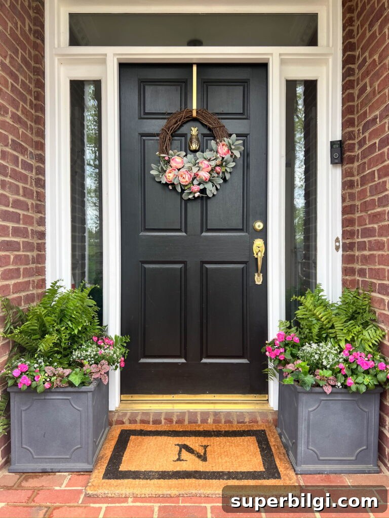 Small Porch Decorating Ideas to Maximize Style and Space 4 Planters with spring flowers on small front porch