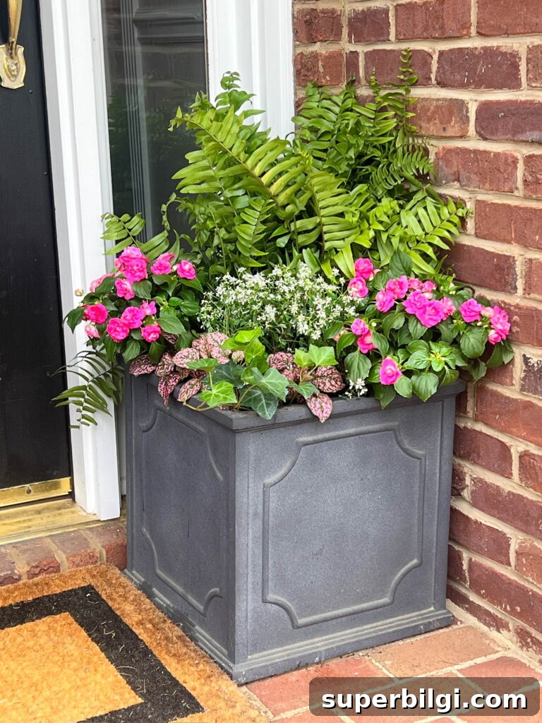 Small Porch Decorating Ideas to Maximize Style and Space 5 front porch planter with spring flowers and a macho fern