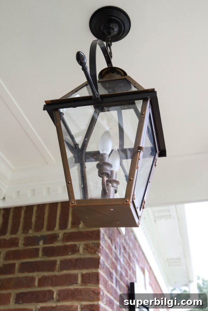 Small Porch Decorating Ideas to Maximize Style and Space 6 Quoizel Rue De Royal Industrial Bronze 2-light Outdoor Hanging Lantern