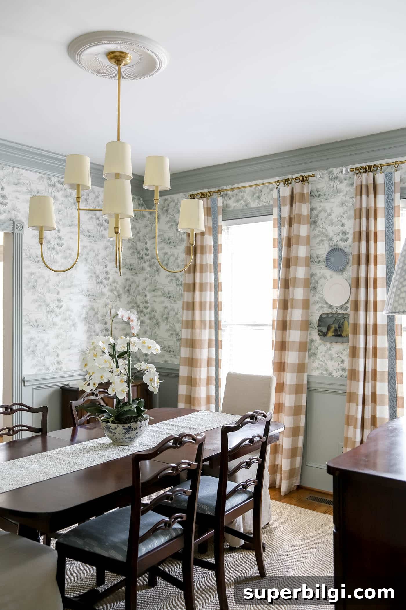 How to Hang Decorative Plates on a Wall Safely 3 dining room with plates hung on a wall, gingham curtains, brass chandelier and dark brown dining table and chairs.