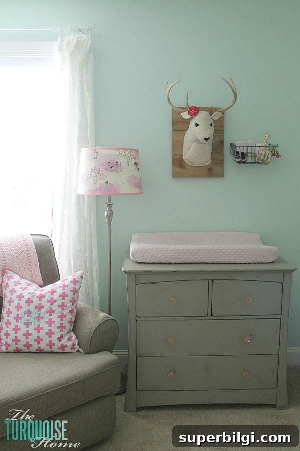 All of the pretty pink and turquoise touches with a woodland theme make a sweet retreat for any little girl.