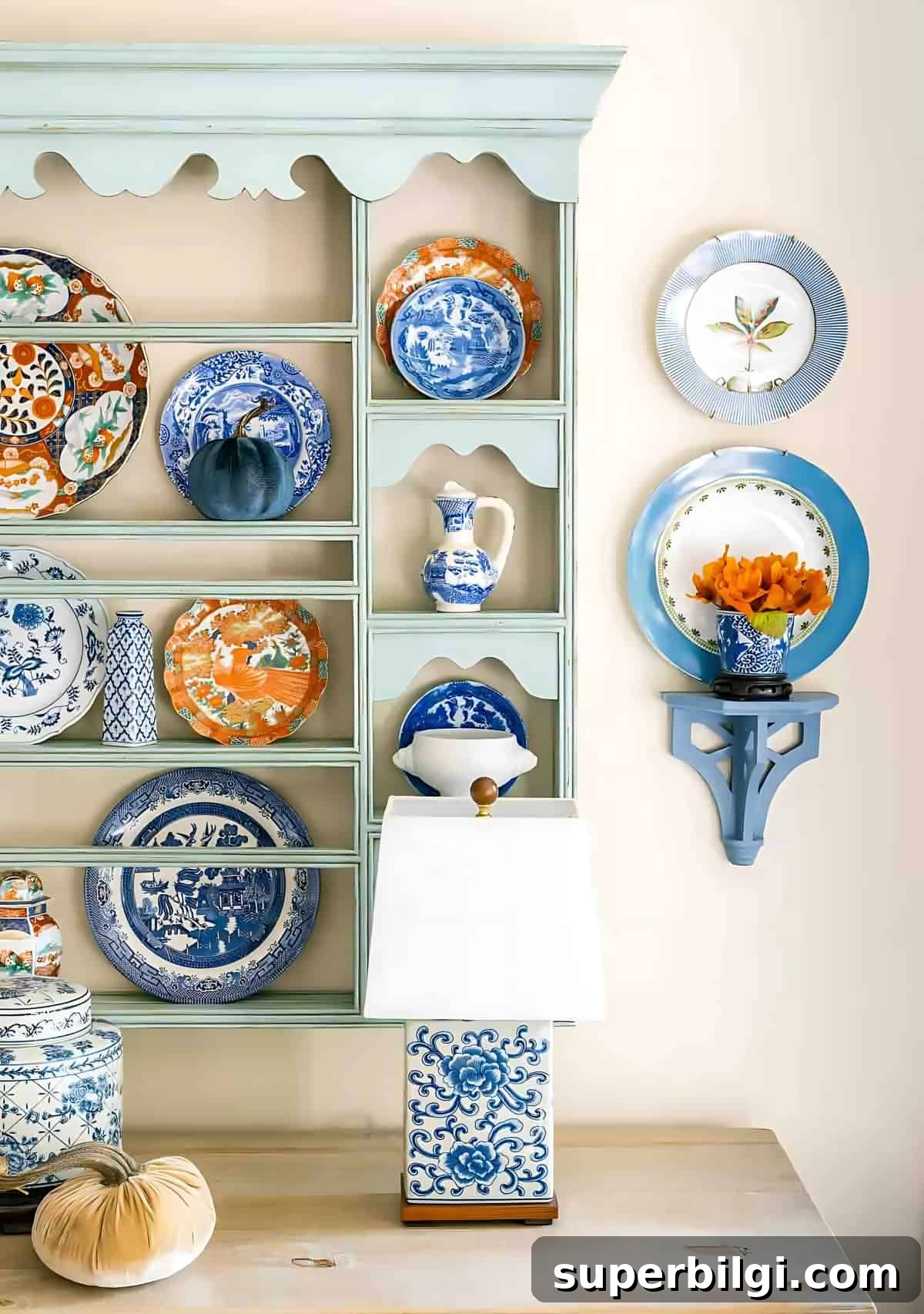 Fall Plate Display Ideas, Free Pumpkin Printables and Cozy Kitchen 4 blue and white plates in a plate rack and on the wall.