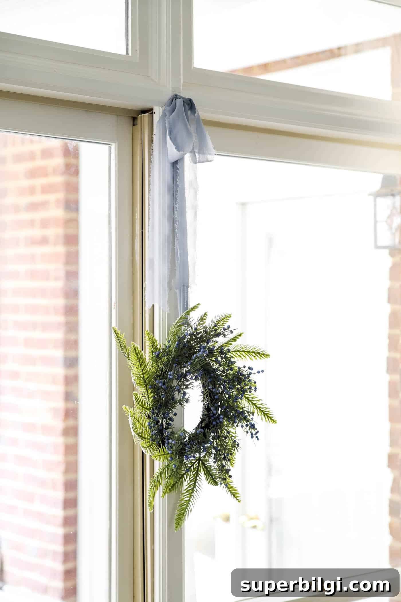 Christmas Decor Trends to Expect in 2025 7 Christmas Wreath in Window