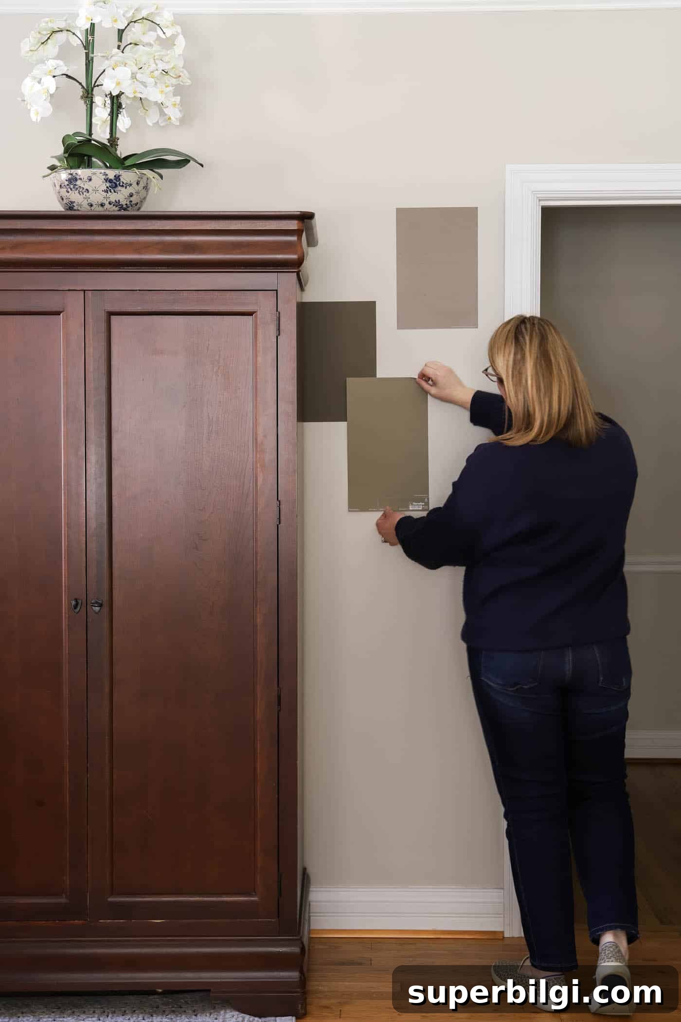 Benjamin Moore Davenport Tan (HC-76): Primary Bedroom Makeover 4 trying out brown paint color samples.