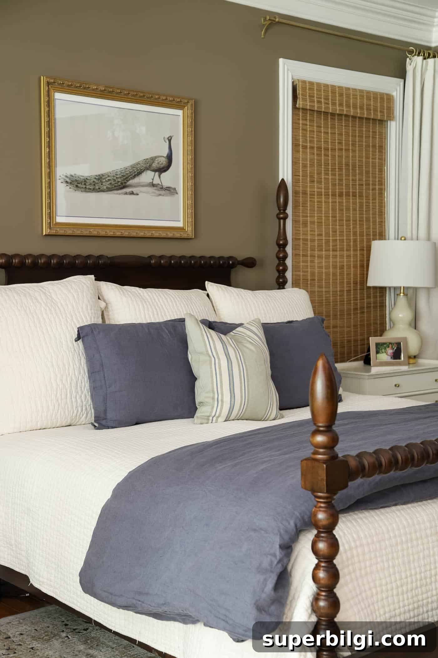 Benjamin Moore Davenport Tan (HC-76): Primary Bedroom Makeover 8 Davenport Tan wall color in a primary bedroom with an ivory quilt and blue bedding.