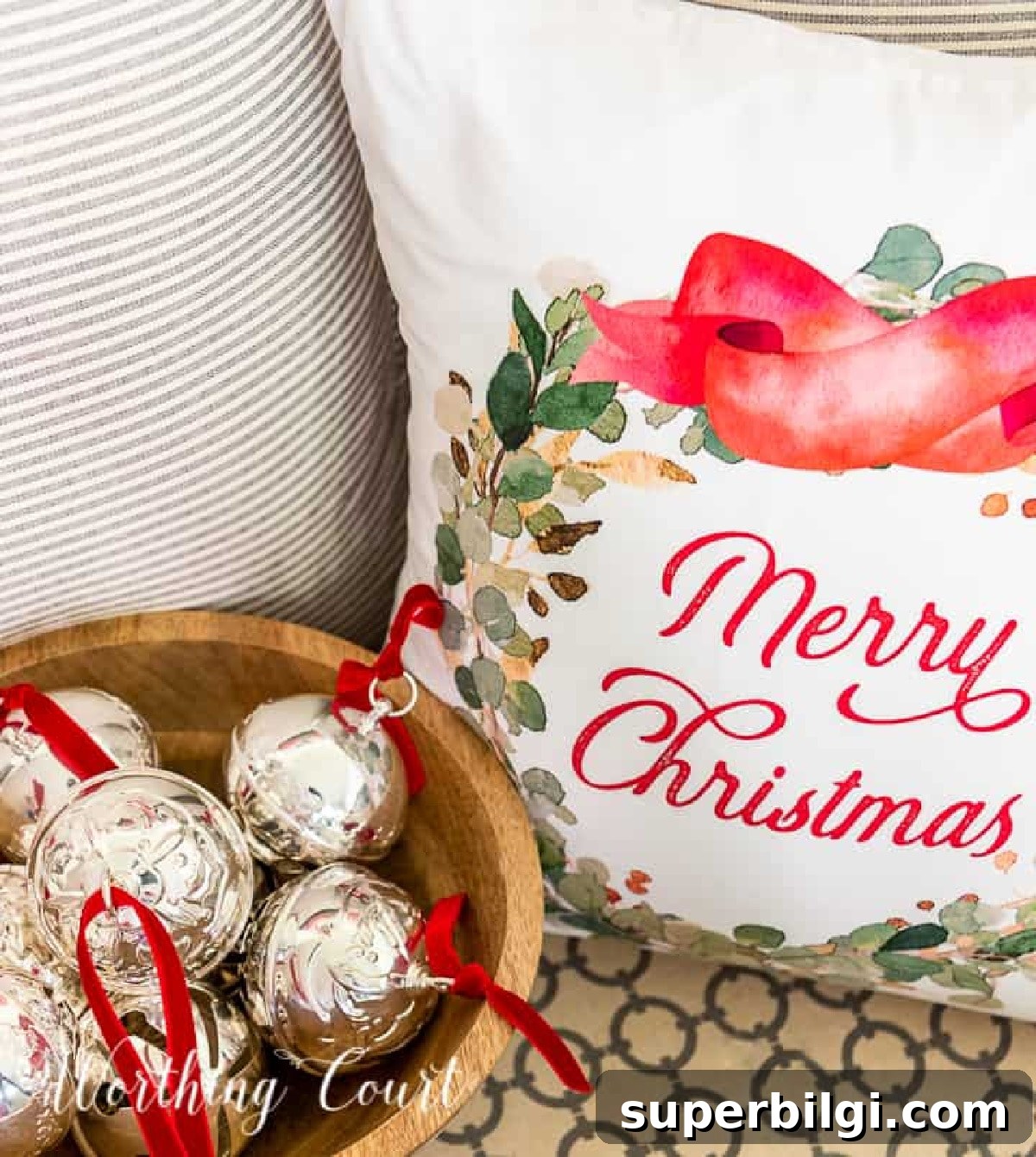 Holiday Prep: Thanksgiving Table Ideas and Entryway Decor 4 christmas ornaments in a bowl next to a christmas pillow.