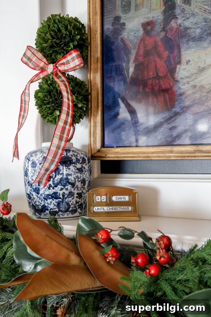 chinoiserie pot with boxwood and ribbon next to a Christmas countdown.