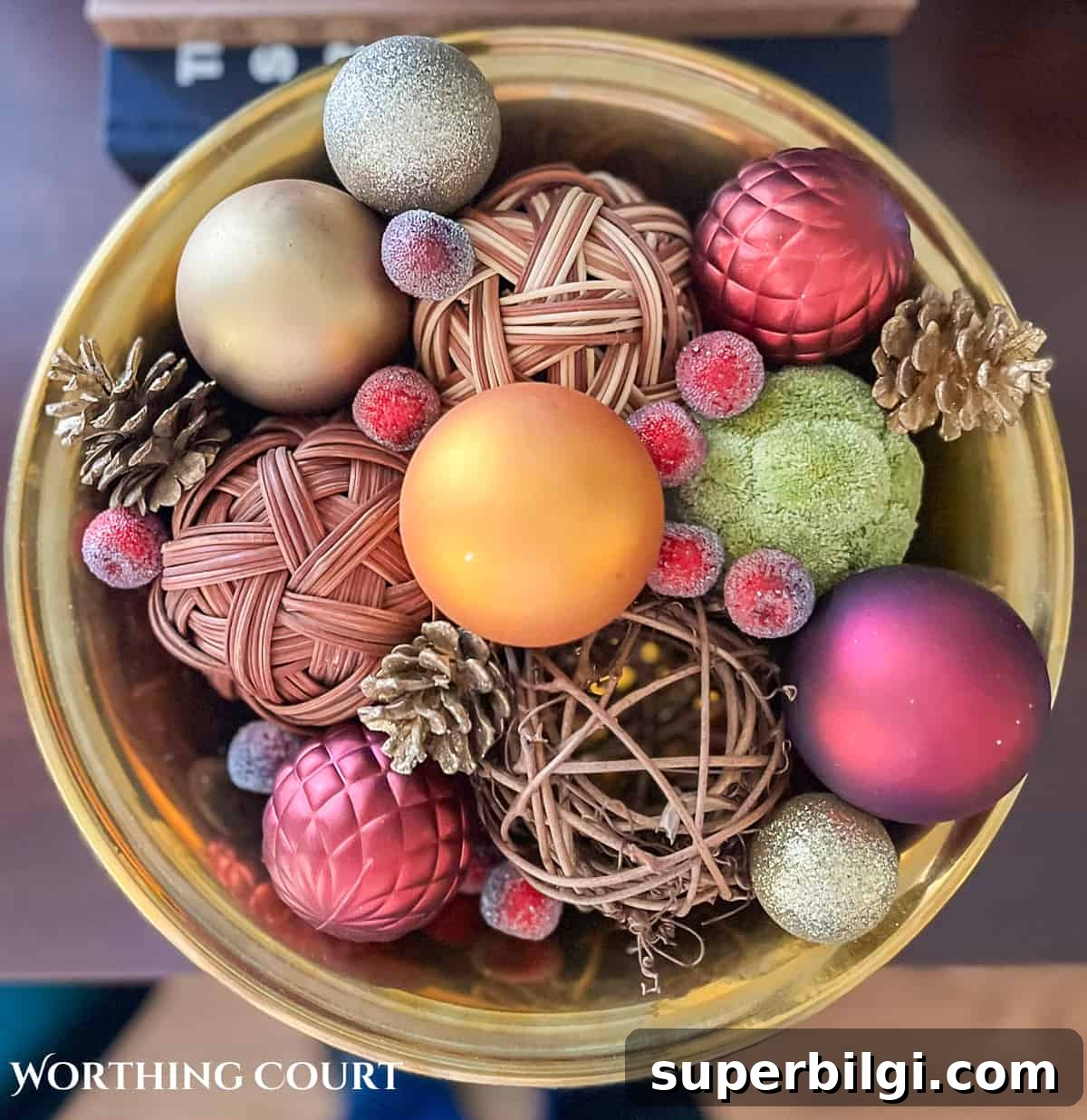 decorative bowl of christmas ornaments and other baubles.