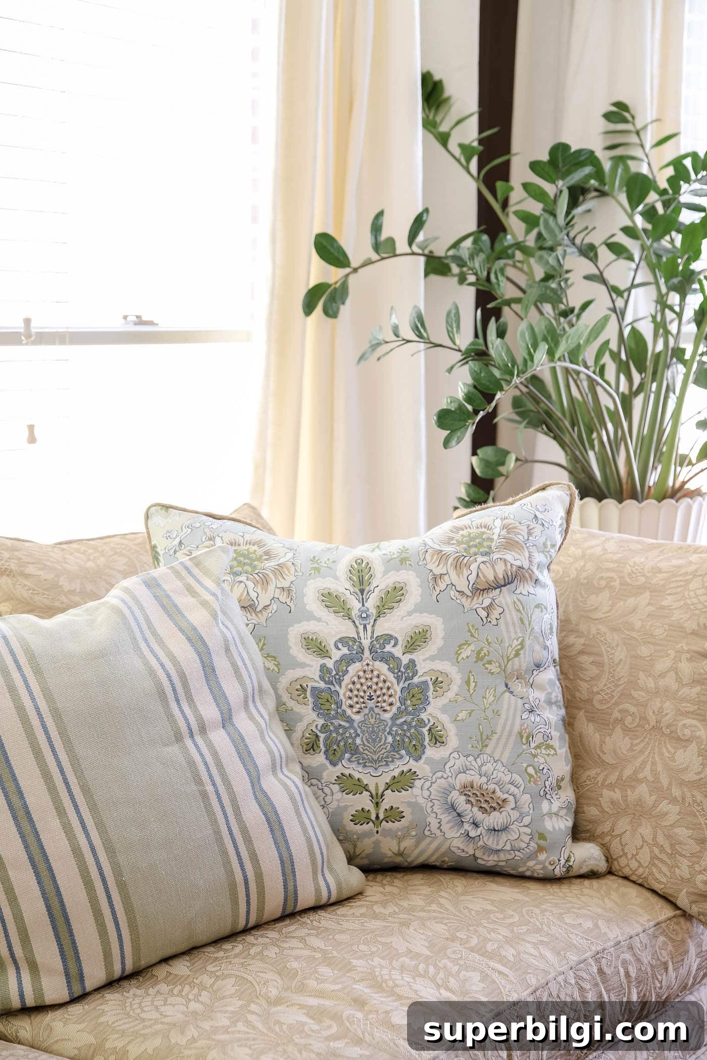 Spring Bedroom Decor Ideas to Instantly Refresh Your Space 14 stripe and floral throw pillows for spring bedroom decor.