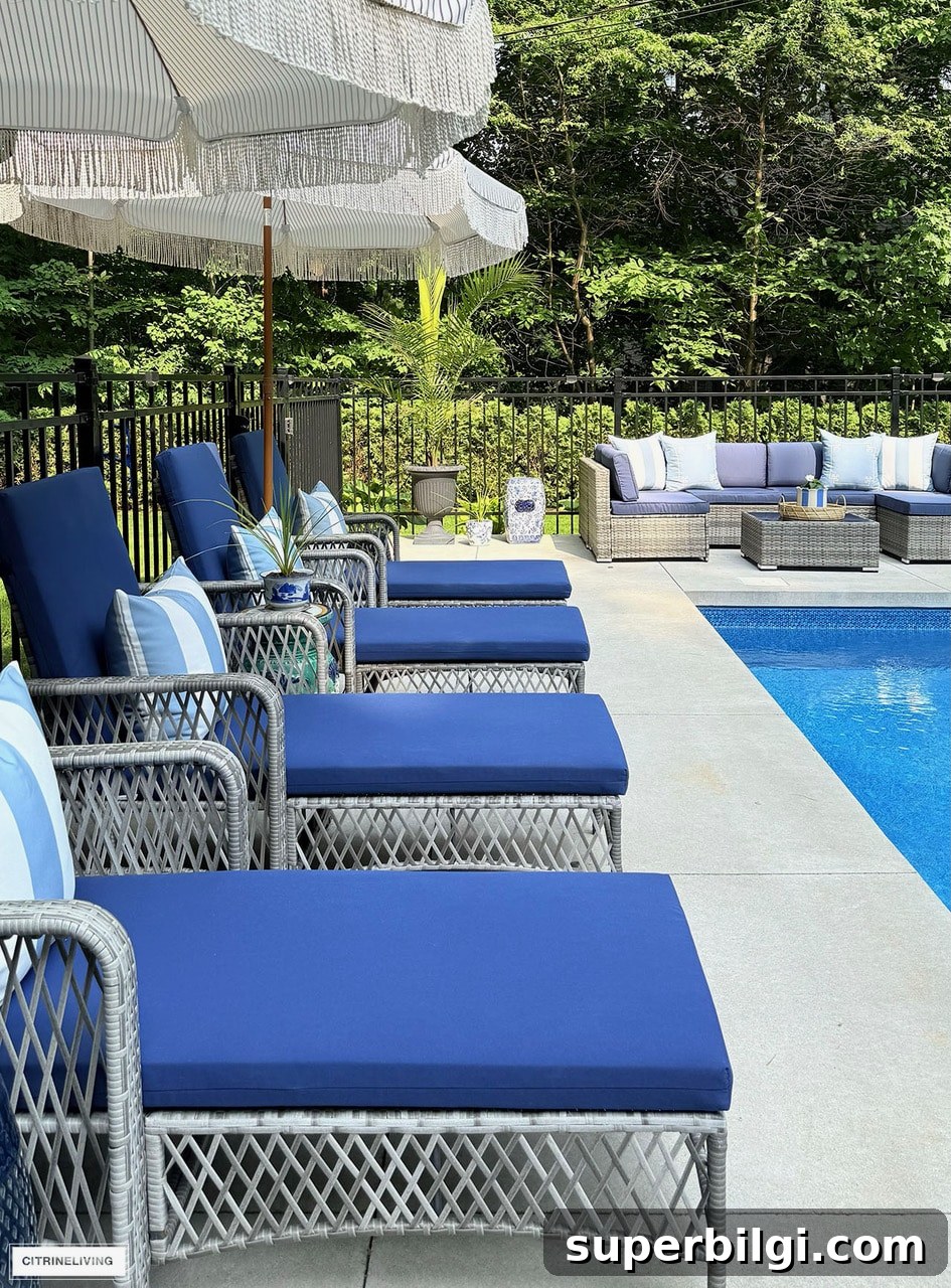 Small Porch Ideas, Pool Updates and Timeless Neutral Paint 6 Backyard pool patio ideas with blue lounge chairs, wicker outdoor sectional and navy outdoor decor